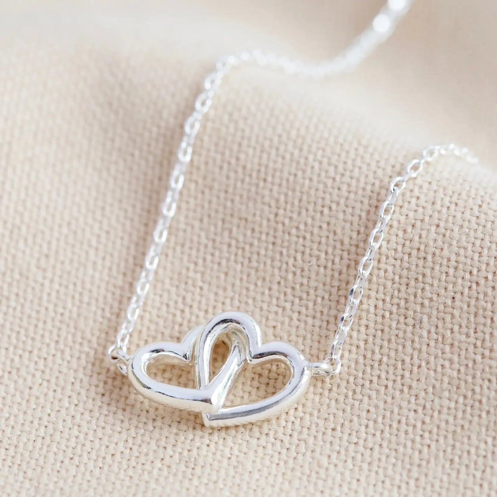 Tiny Interlocking Hearts Necklace in Silver