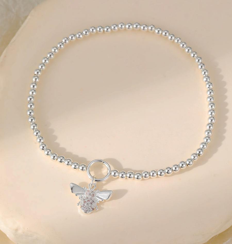Stretchy ball bracelet with bee charm