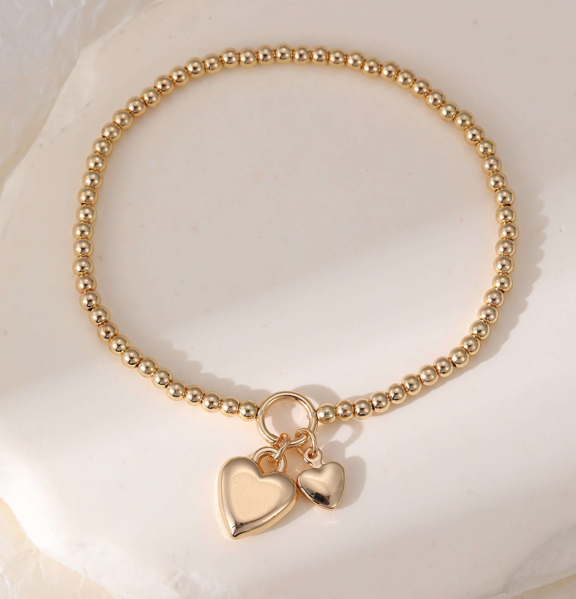 Stretchy Gold Ball Bracelet With Heart Charm