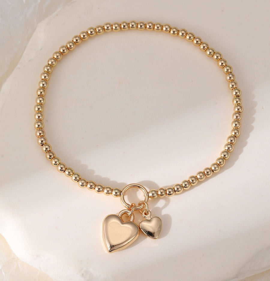 Stretchy Gold Ball Bracelet With Heart Charm